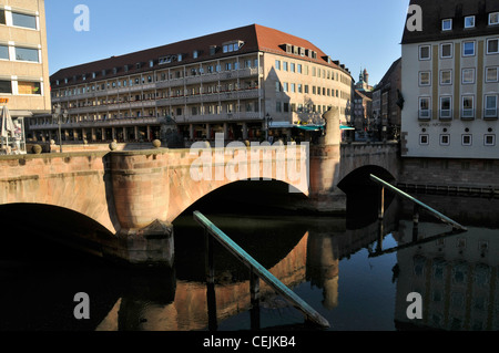 The Museum bridge (Museumsbruck) over the river Pegnitz connecting Konigstrabe and Plobenhofstrabe at Nuremberg in Bavaria, Germany Stock Photo