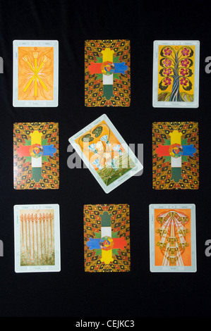 Tarot cards layed out in a square with Disappointment card in the middle at an angle Stock Photo