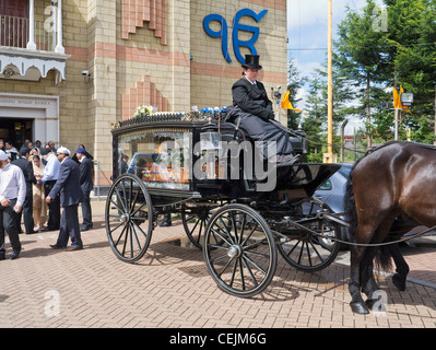 Horse Drawn Funeral Carriage at Sikh Temple in Hounslow London Stock Photo
