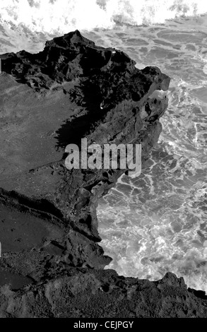 Black rocky coast above the sea in Mauritius (Gris Gris). Stock Photo