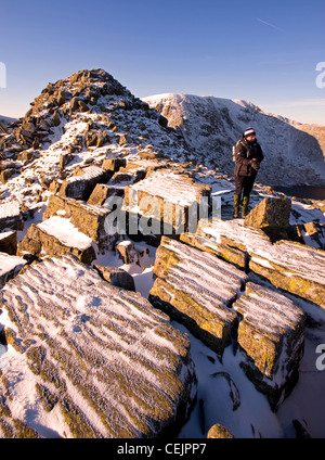 Walker on Striding Edge, Helvellyn in Lake District, Cumbria Stock Photo