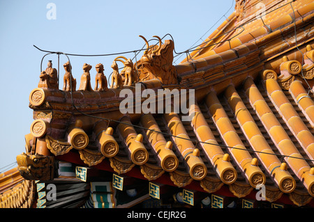 Detail detailed terracotta yellow ornate roof tiles Forbidden City Beijing China Yellow represents emperor Royalty figures Stock Photo