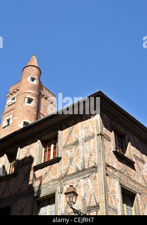 Old architecture made of red bricks against a bright blus sky in Toulouse, south of France Stock Photo