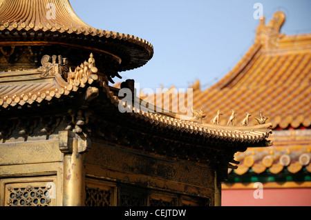 Detail detailed terracotta yellow ornate roof tiles Forbidden City Beijing China Yellow represents emperor Royalty figures Stock Photo