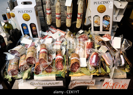 Montepulciano, Tuscany, Italy. Local food cured meat pork sausage salami wine farm produce display for sale in street shop Stock Photo