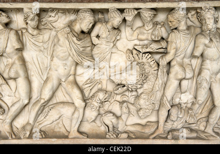 Roman period carved stone relief sarcophagus panel inside the Camposanto Monumentale cemetery. Pisa, Tuscany, Italy. Boar hunt Stock Photo