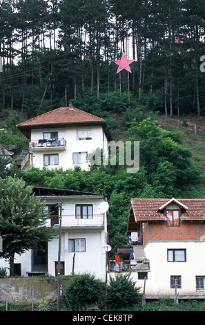 Private houses with a communistic red star fixed on a wooden construction, Bijelo Polje, Montenegro, Balkans Stock Photo