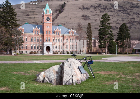 A glacial boulder sits on the lawn at the University of Montana campus in Missoula, Montana. Stock Photo