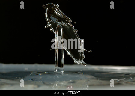 Water drop falling and colliding with another one Stock Photo