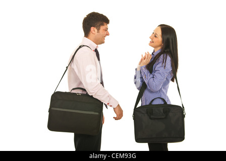 Colleagues man and woman with suitcase meets and having funny conversation isolated on white background Stock Photo