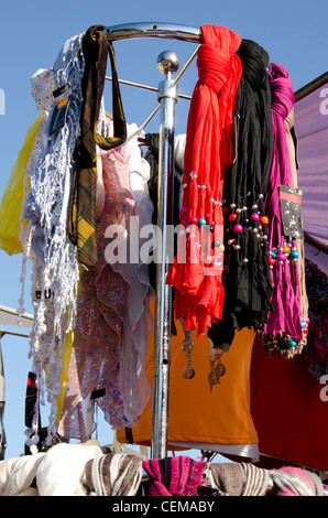 Headscarf cloak and decorative colored scarves sold at market street fair. Stock Photo