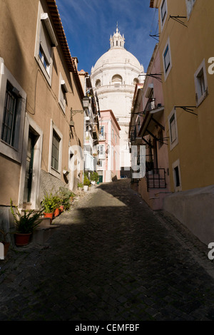 Panteão Nacional (Church of Santa Engrácia) seen through a narrow alley in Alfama, Lisbon, Portugal. Stock Photo