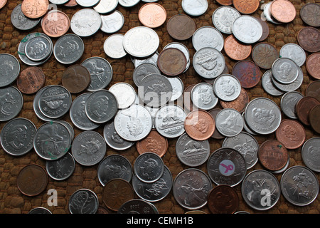 Old and new Canadian coins spread on floor Stock Photo