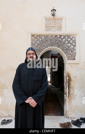 Deir Al Muharraq famous Coptic monastery Assiyut Egypt and coptic monk Stock Photo
