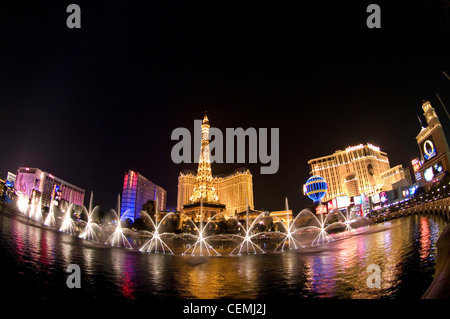 The Fountains of Bellagio play before the Eiffel Tower of the Paris Casino, Las Vegas, Nevada Stock Photo