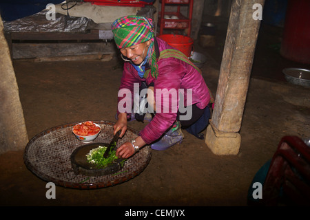 Hmong woman preparing food, Sapa Vietnam Stock Photo