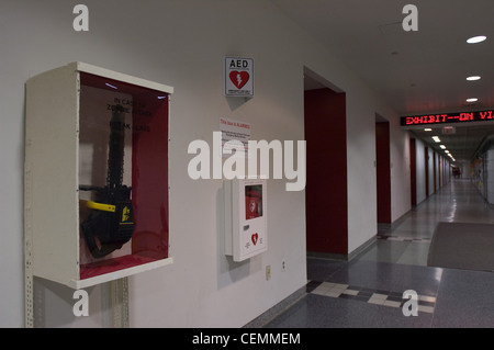 MIT hack prank zombie attack boxes chainsaw -- "in case of zombie attack break glass" boxes appeared next to the automatic defibrilator in the lobby of building 56 Stock Photo