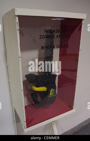 MIT hack prank zombie attack boxes chainsaw -- "in case of zombie attack break glass" boxes appeared next to the automatic defibrilator in the lobby of building 56 Stock Photo