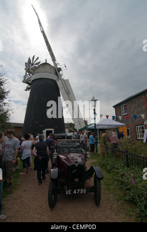 Summer village fete with old car and windmil Stock Photo