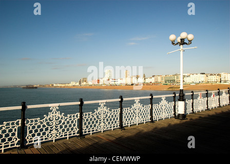 The view west from Brighton Pier with the remains of the West Pier in the background. Stock Photo