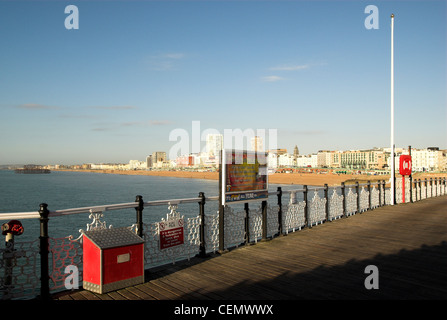 The view west from Brighton Pier with the remains of the West Pier in the left background. Stock Photo