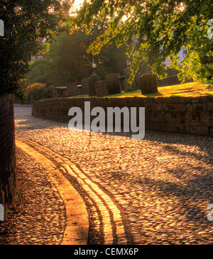 The cobbled area in Grappenhall Village, South Warrington at Sunset. (Church lane, adjacent to St Wilfrids parish church) Stock Photo