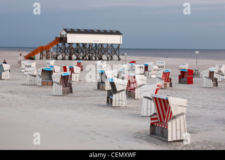 beach chairs and toilets built on stilts on the St. Peter-Ording beach, Germany Stock Photo