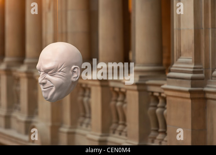 Heads on display from the ceiling of the Kelvingrove Art Gallery and Museum in Glasgow. The exhibit is Expression by Sophie Cave Stock Photo