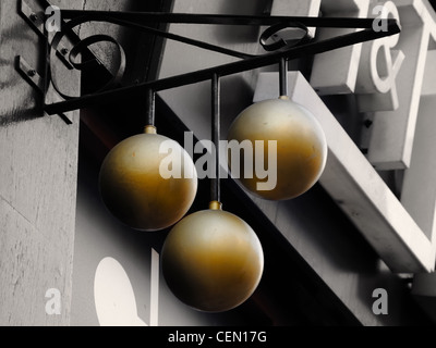 Three balls of a pawnbrokers shop in Glasgow, Scotland. Stock Photo