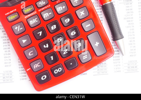 Macro shot of a red calculator and red pen over some business statements on white Stock Photo