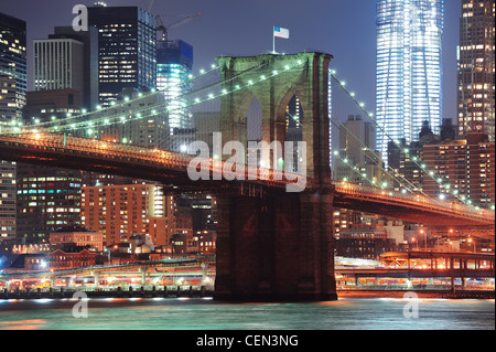 Brooklyn Bridge closeup over East River at night in New York City ...