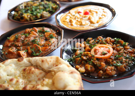 Dishes freshly prepared at an Indian restaurant in England Stock Photo