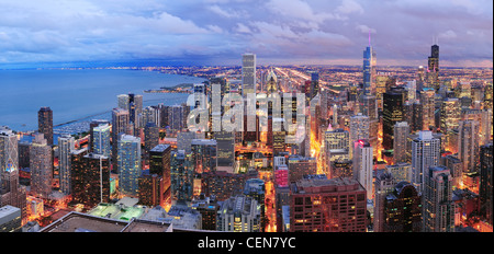 Chicago skyline panorama aerial view with skyscrapers over Lake Michigan with cloudy sky at dusk. Stock Photo