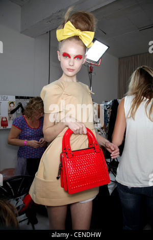 Luella Backstage London Ready to Wear Spring Summer A beige short puffed sleeve minidress iwth a nipped in waist, a large Stock Photo