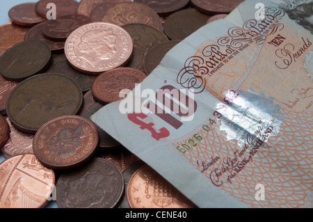 Pile of UK money, including ten pound note and one and two pence pieces Stock Photo