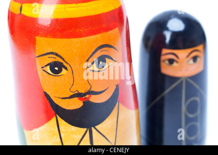 Arab Islamic Muslim man and woman nesting dolls in close up, the woman is wearing a black burka Stock Photo