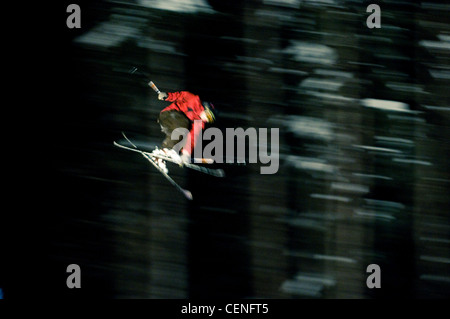 Freestyle ski jumper racing down the hill during the New Years Eve celebrations at Sun Peaks, Kamloops, BC, Canada, 31 DEC 2008. Stock Photo