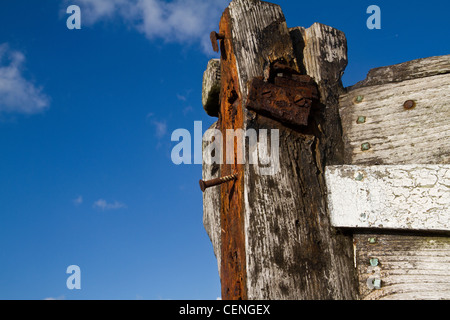 old and abandoned fishing boat on the beach in Dungeness in Kent Stock Photo