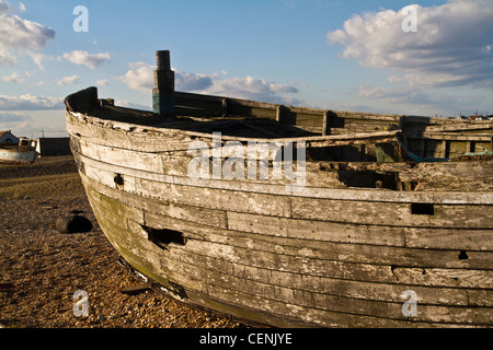 old and abandoned fishing boat on the beach in Dungeness in Kent Stock Photo