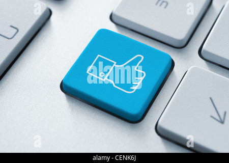 Thumb up like button on the keyboard. Toned Image. Stock Photo