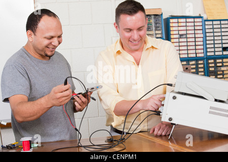 Engineering students using oscilloscope and function generator Stock Photo