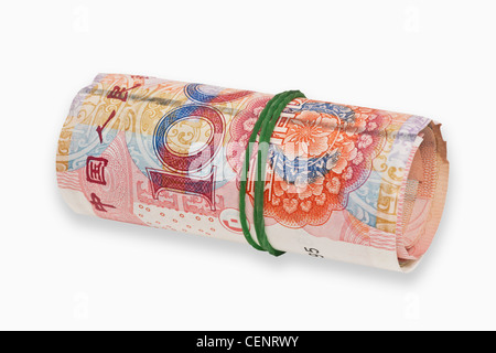 many 100 Yuan bills, rolled up and held together with a rubber. The renminbi, the Chinese currency, was introduced in 1949. Stock Photo