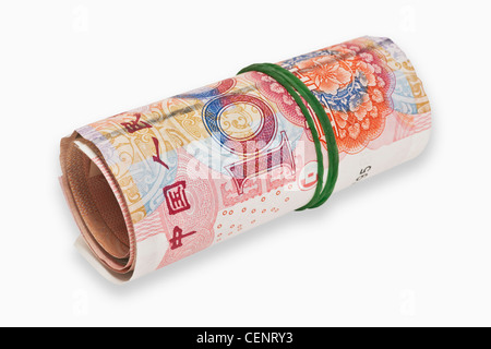 many 100 Yuan bills, rolled up and held together with a rubber. The renminbi, the Chinese currency, was introduced in 1949. Stock Photo