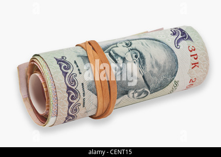 many Indian 100 rupees bills, rolled up and held together with a rubber, India, Asia Stock Photo