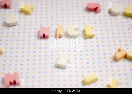 Sugar letter shaped sweets spelling the word nice Stock Photo