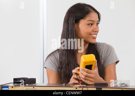 Engineering student using a multimeter Stock Photo