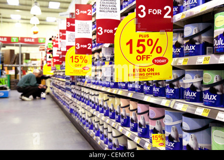 Couple choosing Dulux paint in a DIY store, Homebase UK Stock Photo