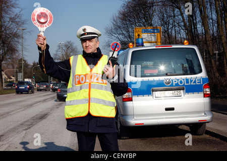 Police control, traffic speed control, police officer stops cars on a street. Stock Photo