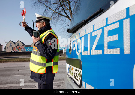 Police control, traffic speed control, police officer stops cars on a street. Stock Photo