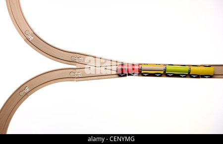 Symbol image. Wooden toy trains on rails. Stock Photo